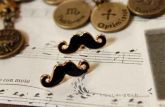Brincos de Bigode Preto e Dourado